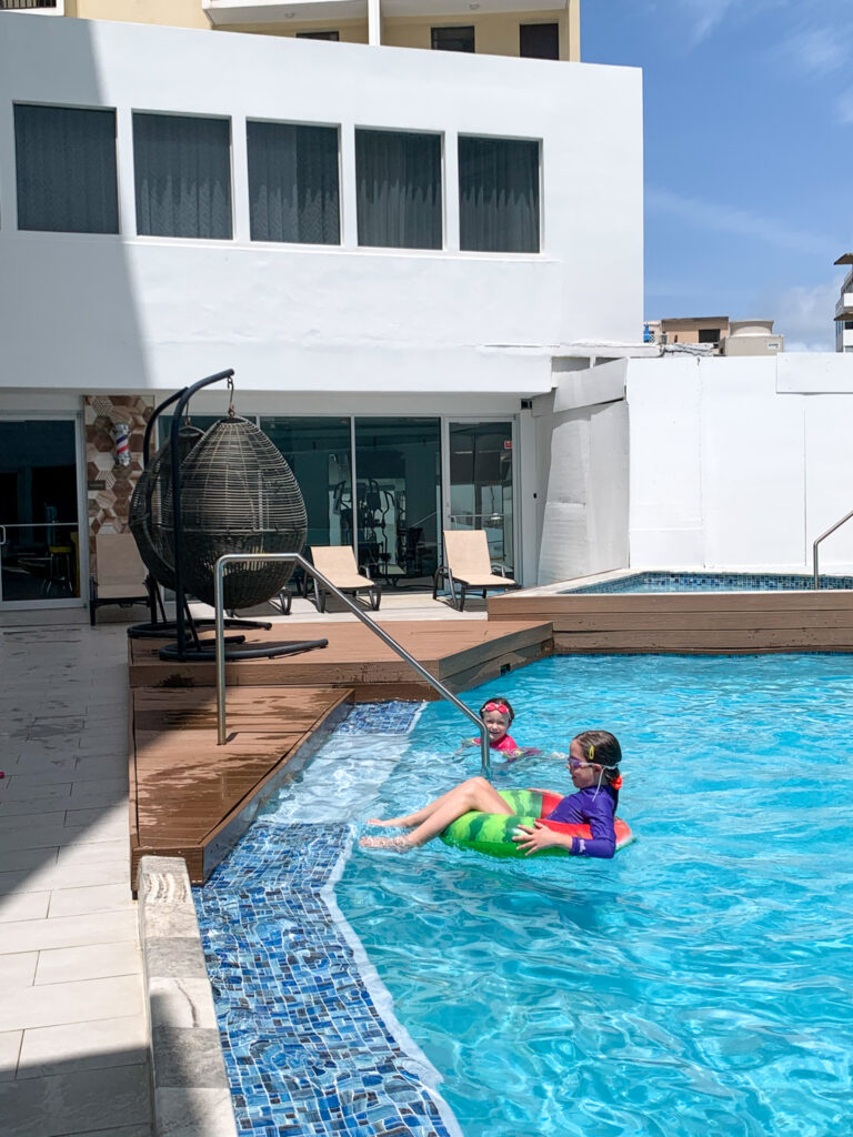 girls swimming in swimming pool at Comfort Inn San Juan