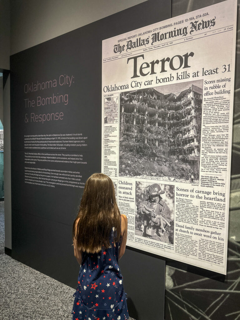 little girl reads about the Oklahoma City Bombing at United States Marshals Museum in Fort Smith, Arkansas