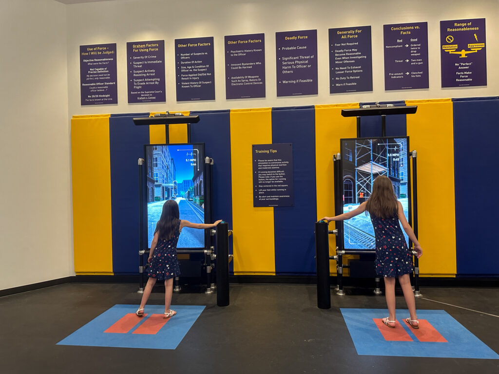 two girls trying to catch a fugitive interactive game at United States Marshals Museum in Fort Smith, Arkansas