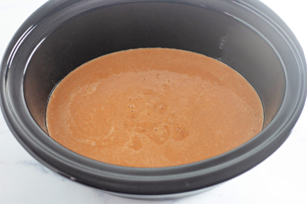 orange mixture in slow cooker base