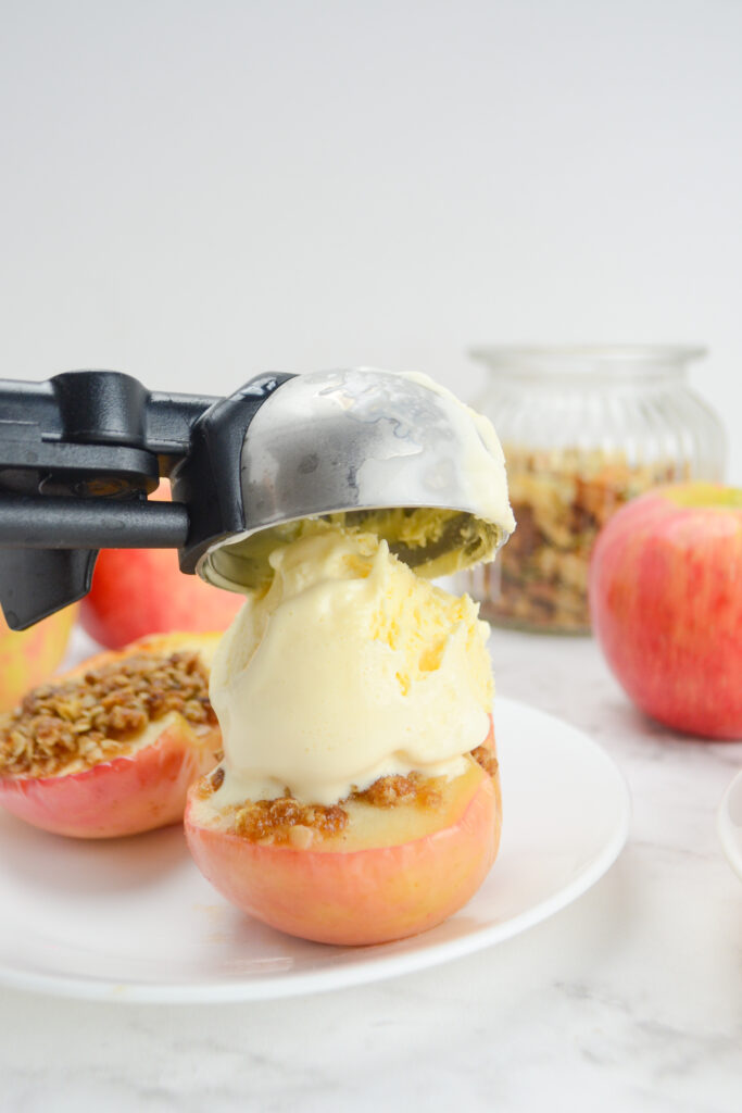 ice cream scooped on top of air fried apples with oats