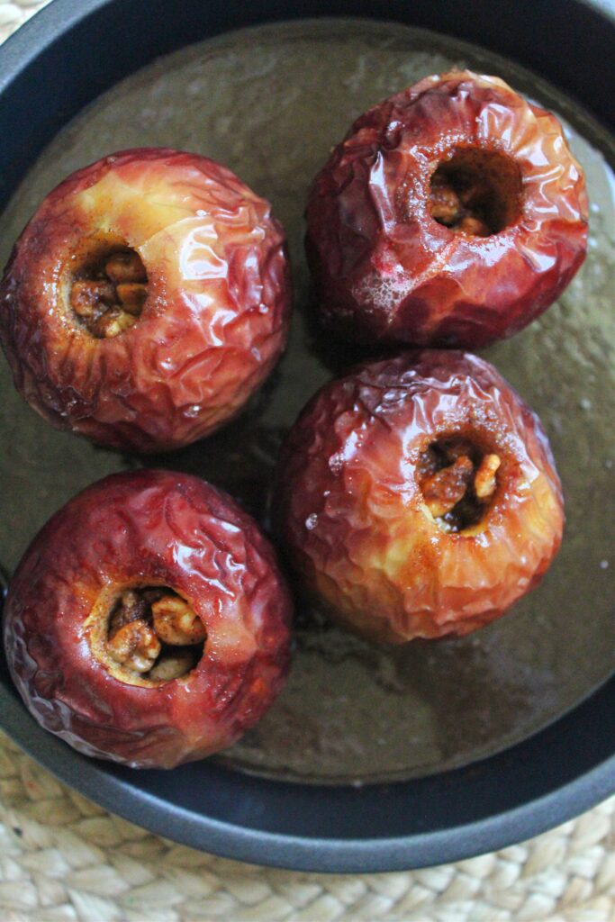 wrinkled baked apples with walnuts fresh out of the oven