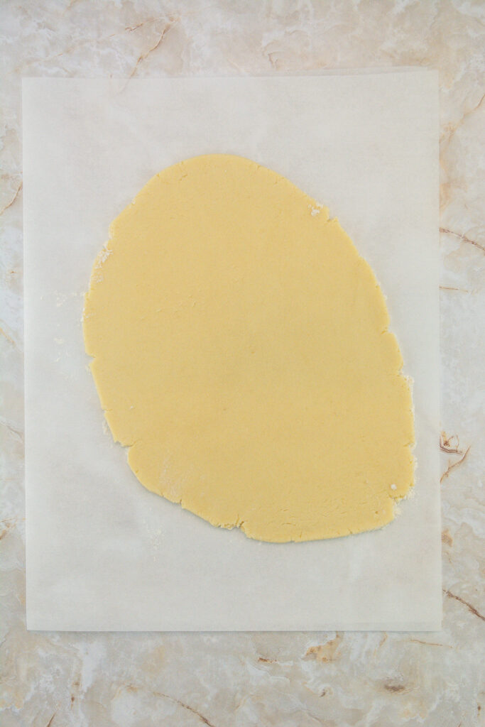 rolled out dough on parchment paper