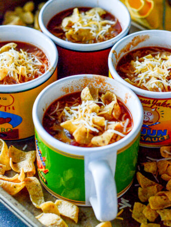 easy stove top chili with tomato sauce in brightly colored soup mugs