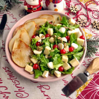 brie pear salad on Christmas backdrop with knife nearby