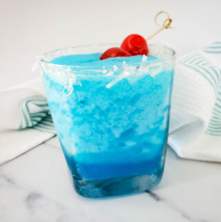 Jack Frost blue Christmas drink with cherries on top