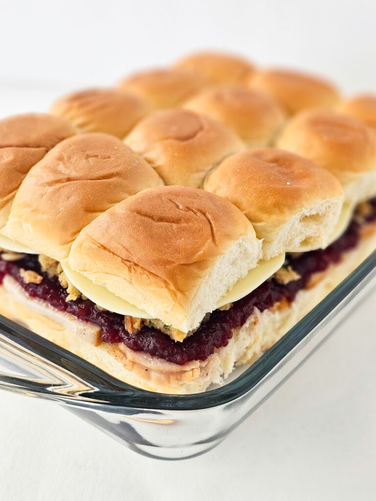 unfinished preparation of cranberry turkey sliders with Hawaiian rolls 