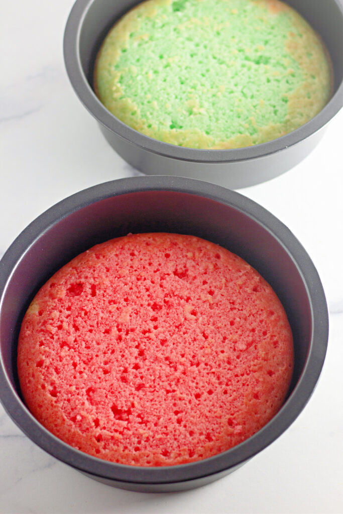 red and green cake layers in cake pans