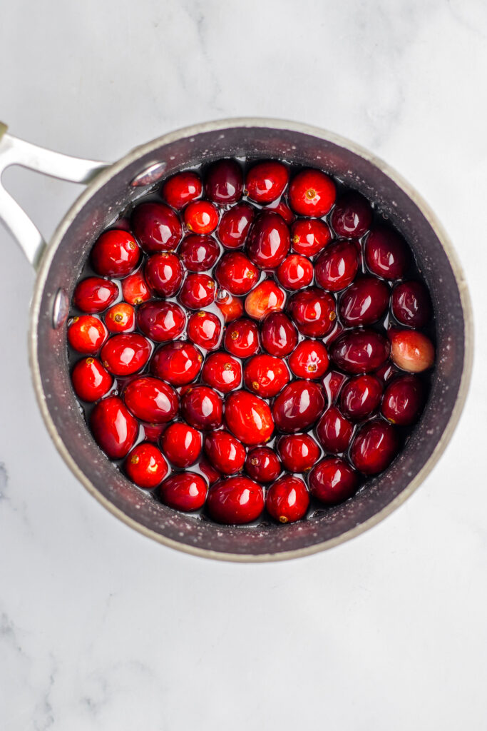 cranberries in sugar water in pot