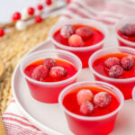 cranberry Jello shots on layered place setting