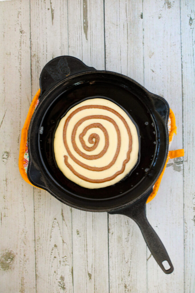 cinnamon swirl pancake batter in a skillet