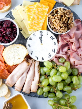 New Year's charcuterie board with cheese clock center
