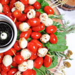 Christmas Caprese skewer salad on white background