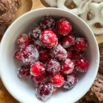 sugared cranberries in white bowl