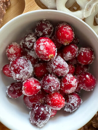 sugared cranberries in white bowl