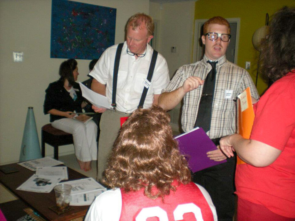 people talking during 1980s murder mystery party - Murder High Reunion