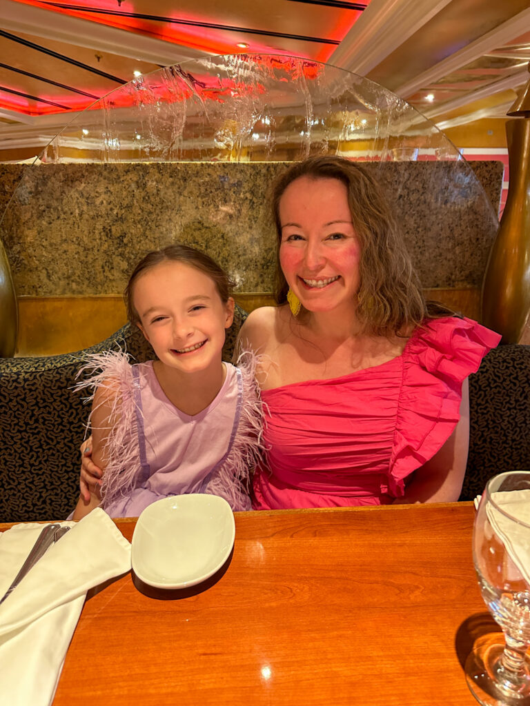 daughter and mom at table in Carnival Valor Lincoln Dining room