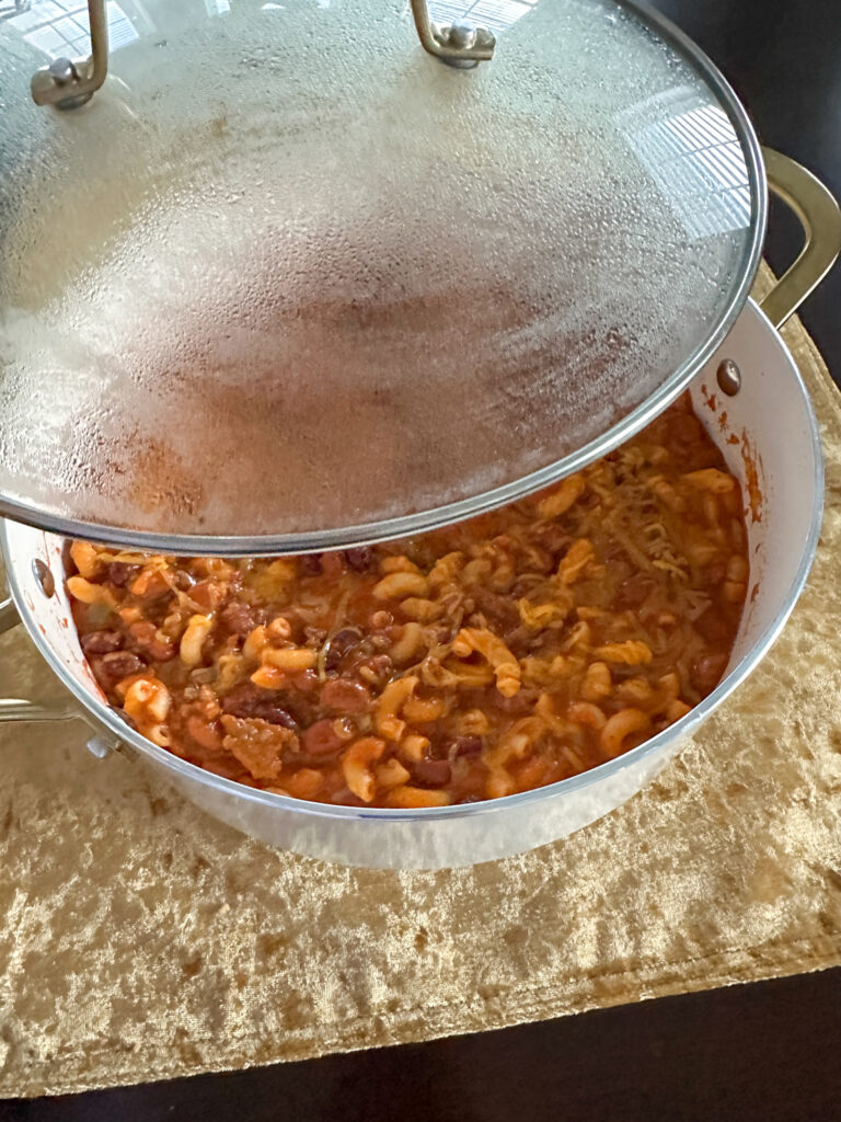 leftover macaroni chili meal in white pot with lid on top