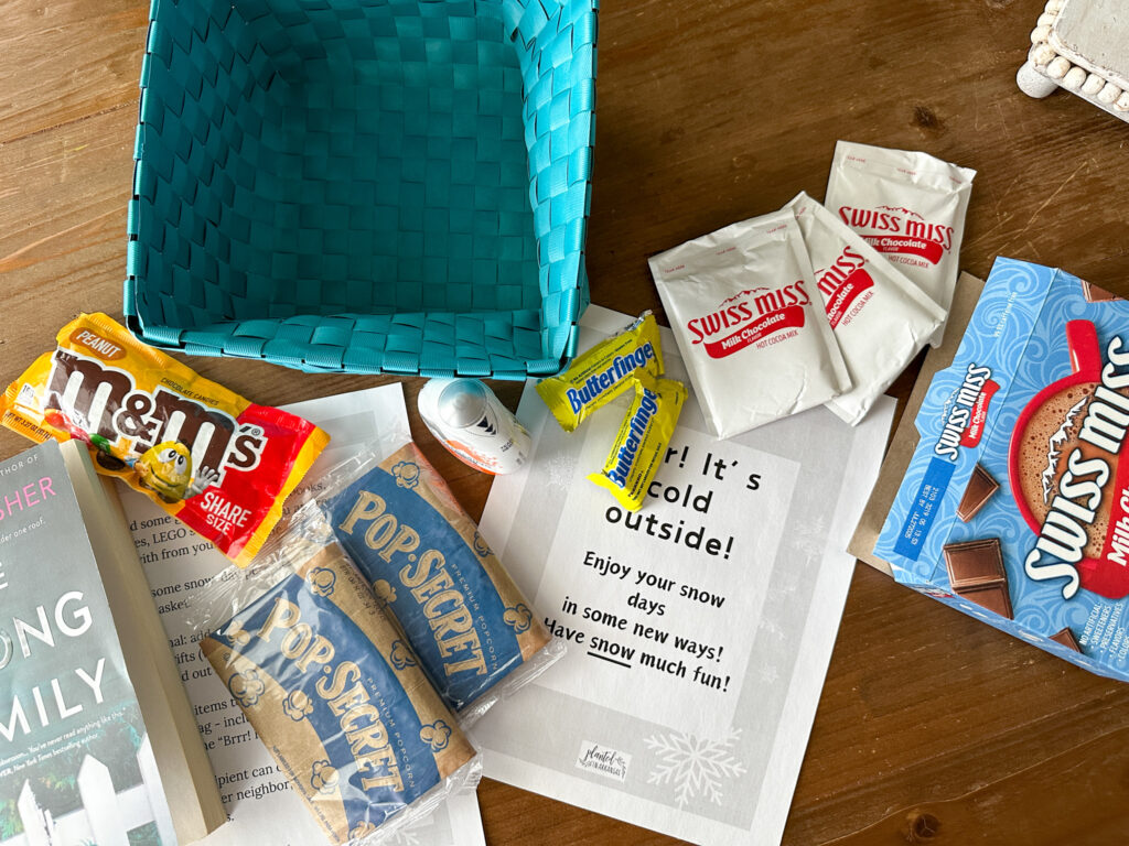 snacks spread on table for snow day survival kit gift