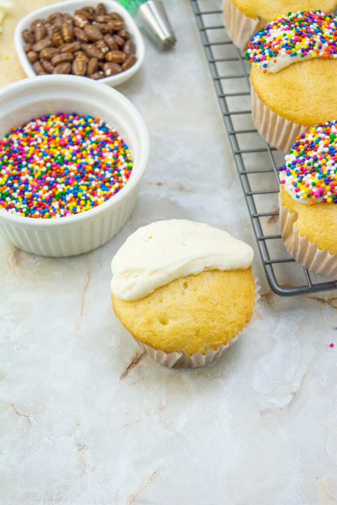 cupcakes with white icing on one half