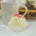 white chocolate Fireball bombs in front of mug