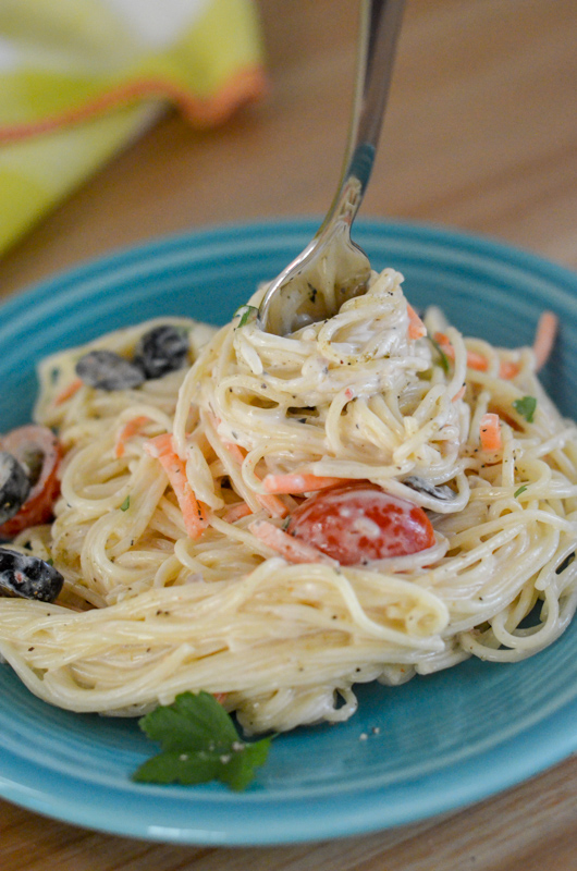 angel hair pasta salad with Italian dressing on blue pate