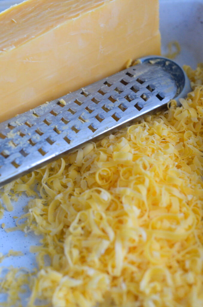 shredded cheddar with cheese grater