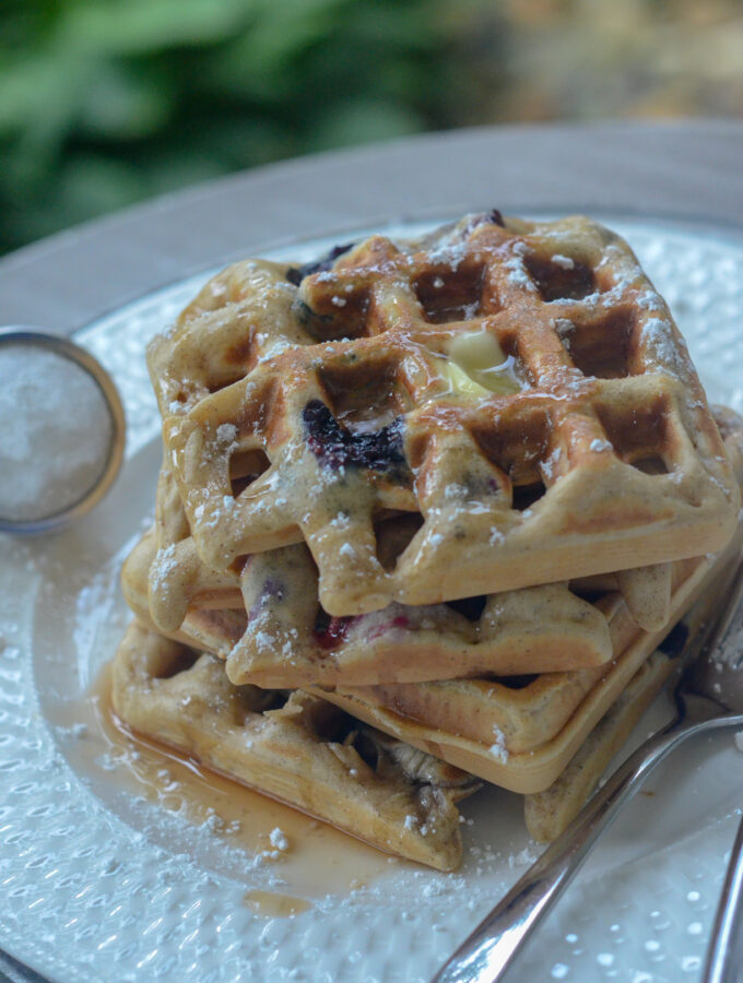 blueberry waffles stacked on plate