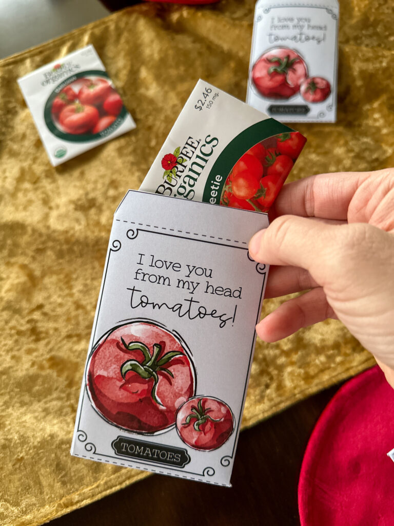 woman puts tomato garden seeds into printable Valentine gifts for gardeners