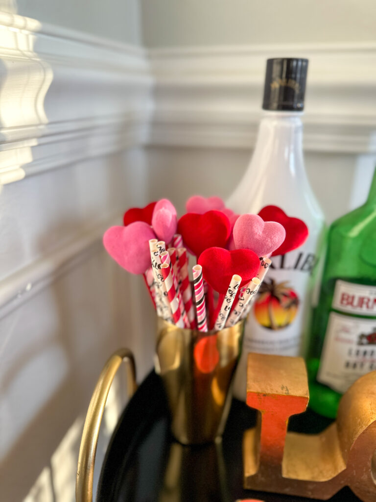 heart picks and Valentine's Day straws in a cocktail shaker