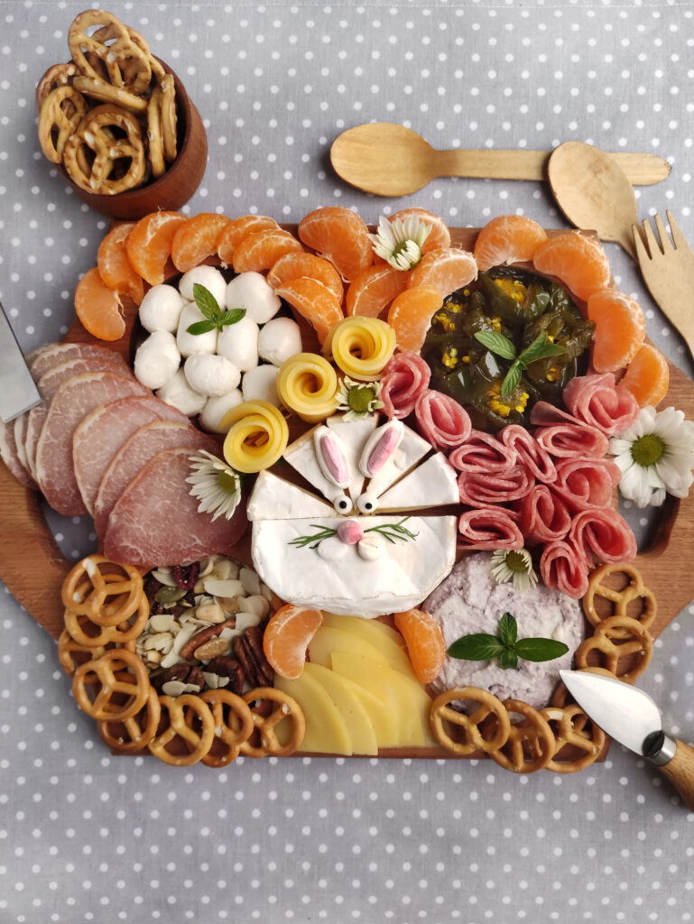 Easter bunny charcuterie board on polka dot background