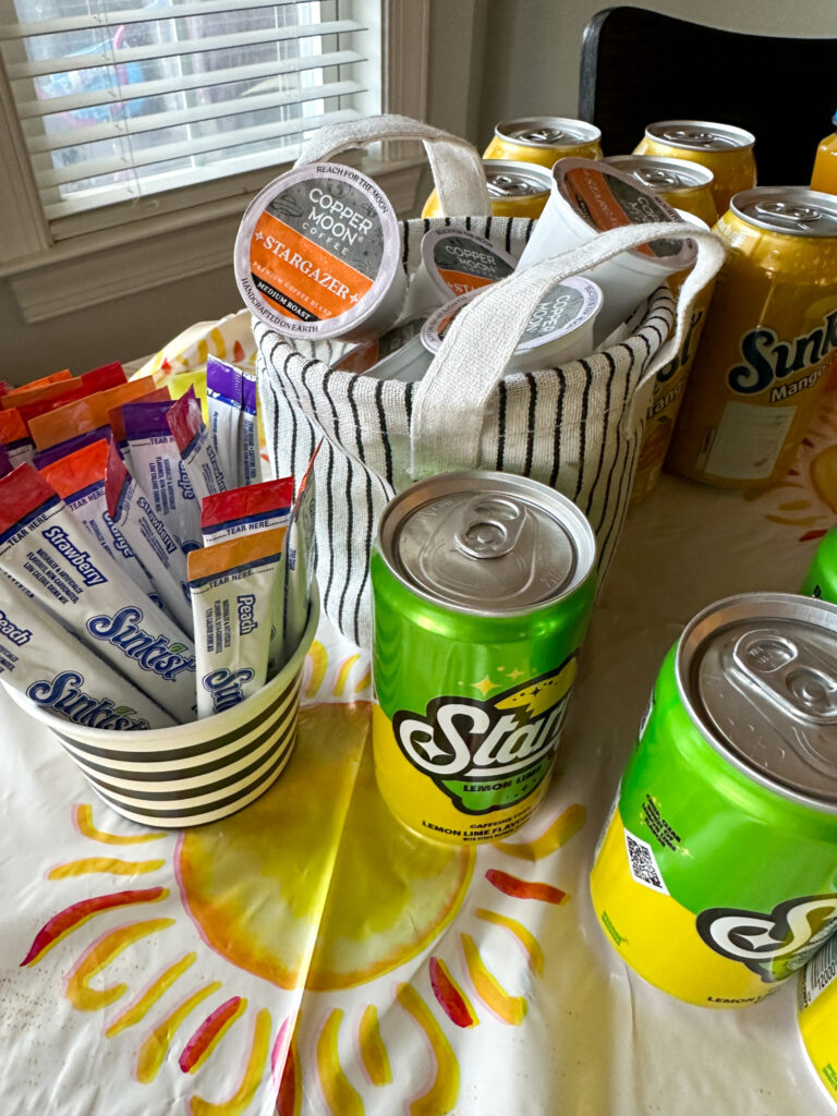 Copper Moon coffee, Sunkist drink mix, Starry soda, and Sunkist soda on a drink table for a sun and moon party