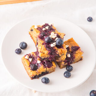 blueberry white chocolate blondies on white plate