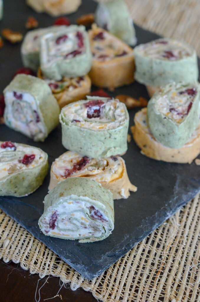 ranch cranberry cream cheese tortilla roll ups on black tray