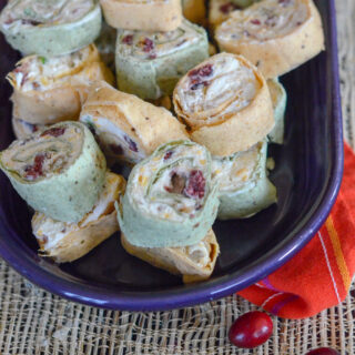 plate of cranberry tortilla roll ups with bacon