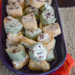 oval platter of cranberry tortilla roll ups with bacon