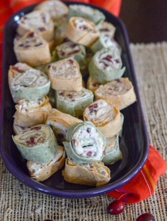 oval platter of cranberry tortilla roll ups with bacon