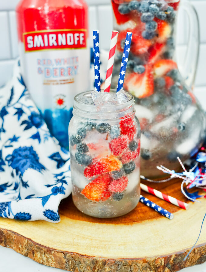 fruit Smirnoff punch in Mason jar with straws for July 4th