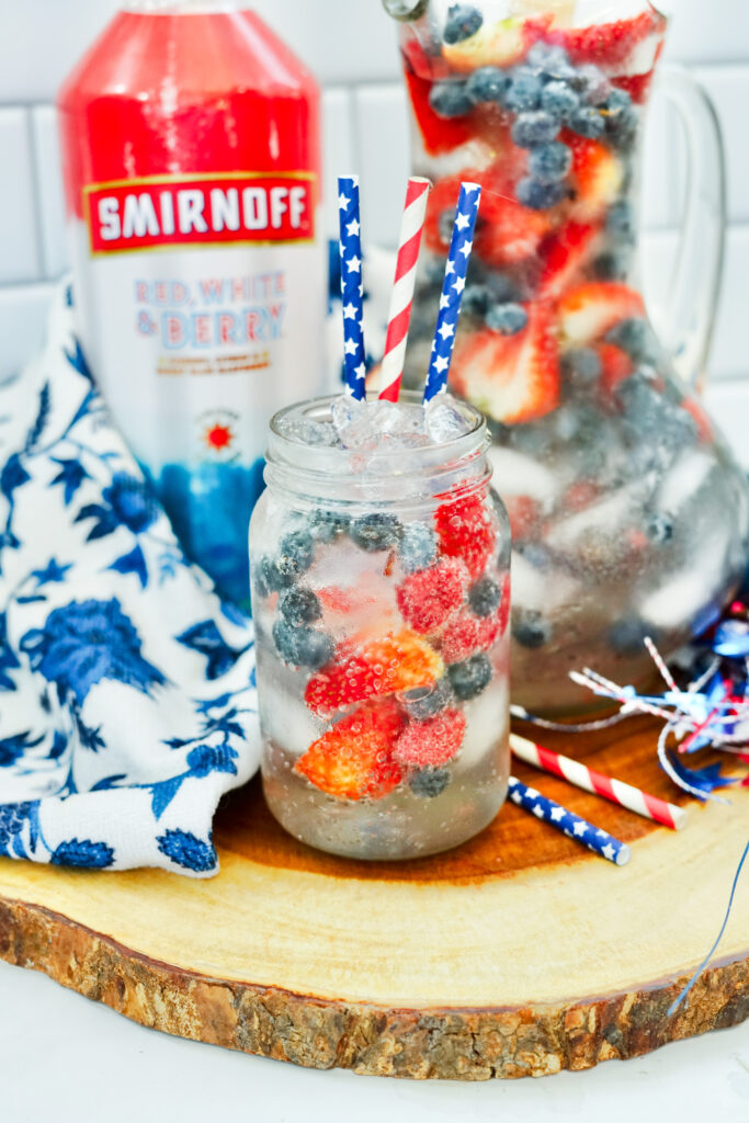 fruit Smirnoff punch in Mason jar with straws for July 4th