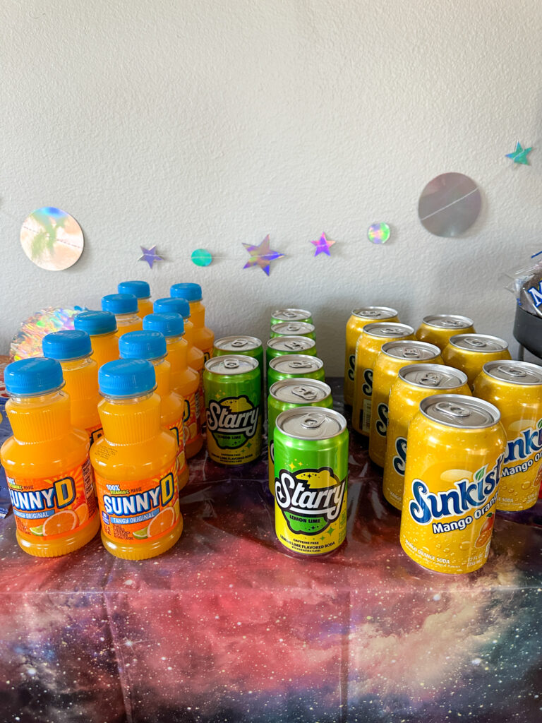 drink station of Starry, Sunny D and Sunkist for outer space party ideas (galaxy party ideas)