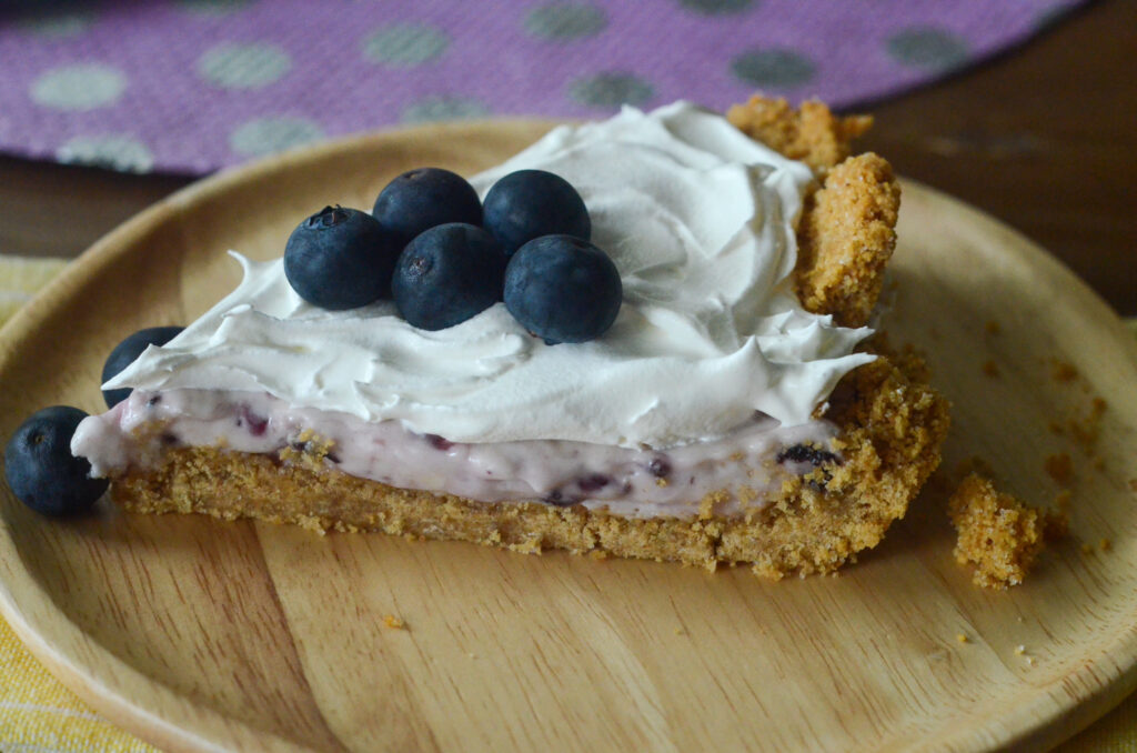 side shot of no bake blueberry cream pie with graham cracker crust