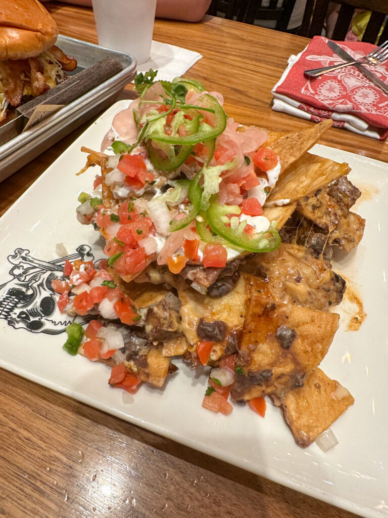 trashcan nachos on white plate at Guy Fieri's Branson Kitchen + Bar for favorite places to eat in Branson Landing