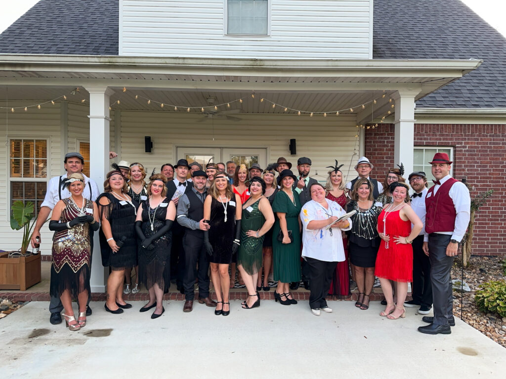 a group of people dressed in 1920s outfits and speakeasy costumes
