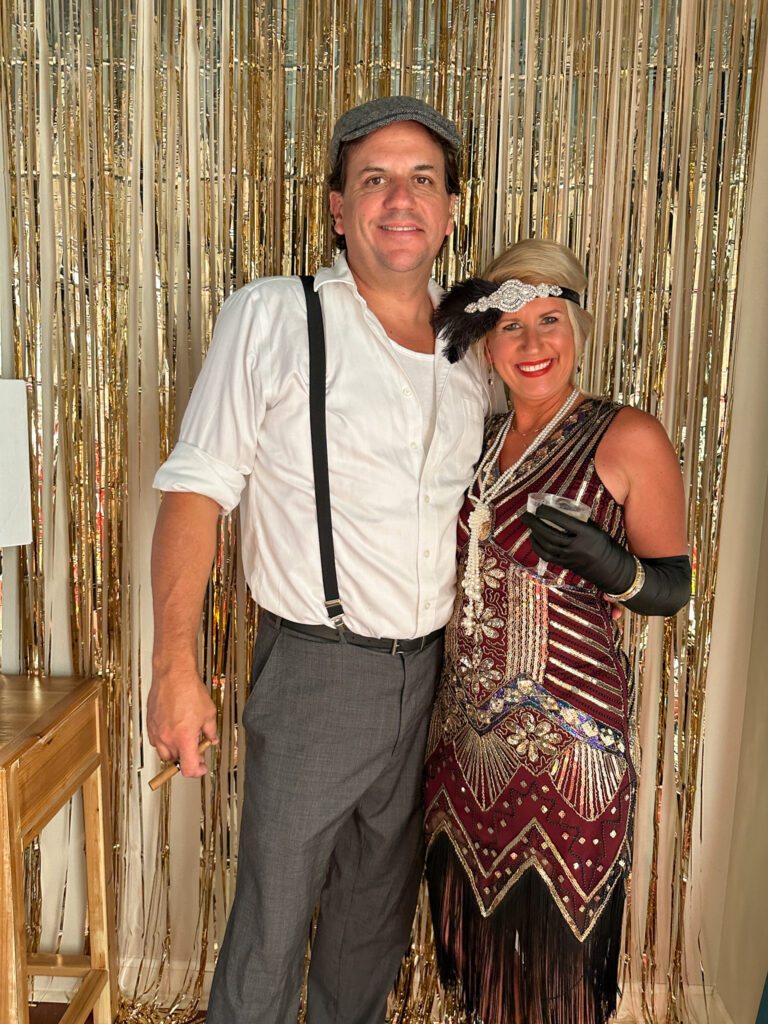 couple dressed up in costume for Roaring 20s party murder mystery