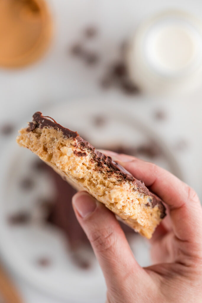 woman holding choc peanut butter Rice Krispie treat