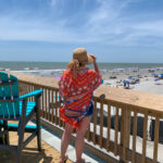 woman exploring things to do in Folly Beach while standing on Folly Beach Pier