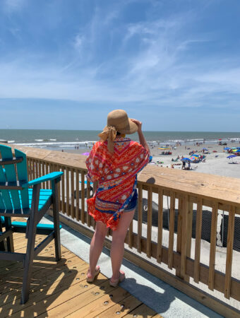 woman exploring things to do in Folly Beach while standing on Folly Beach Pier