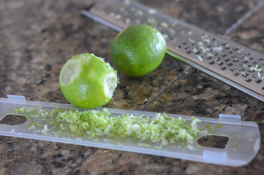 lime zester microplane grater with two limes nearby