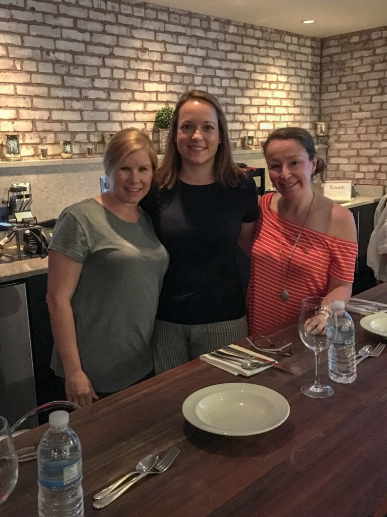 three women at in a Savannah cooking class at what is now the Cooking School at Hotel Bardo Savannah