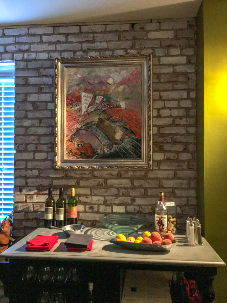 a table set up with wine and fruit